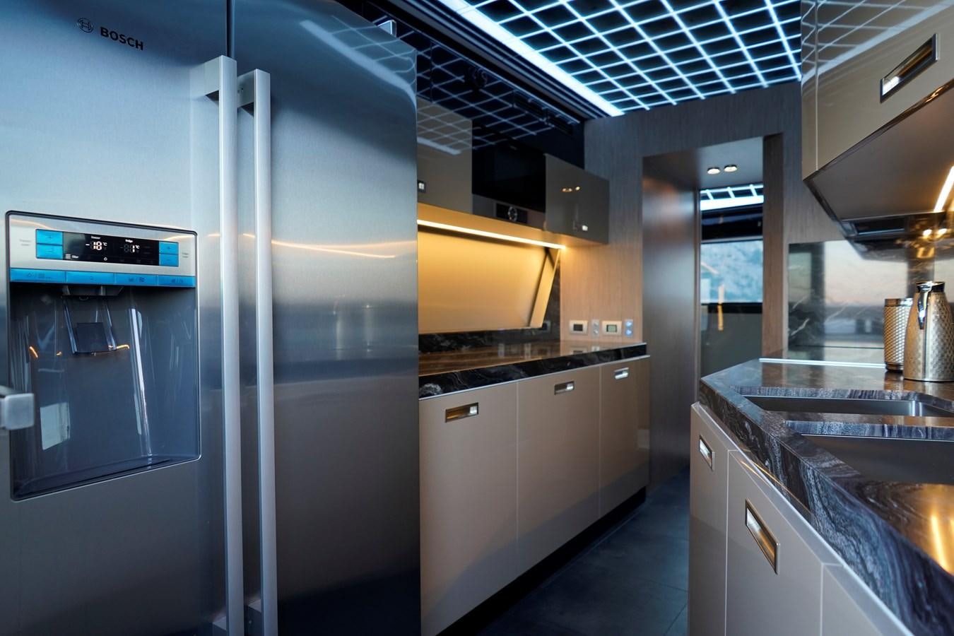 a kitchen with stainless steel appliances aboard ARCADIA A85 Yacht for Sale
