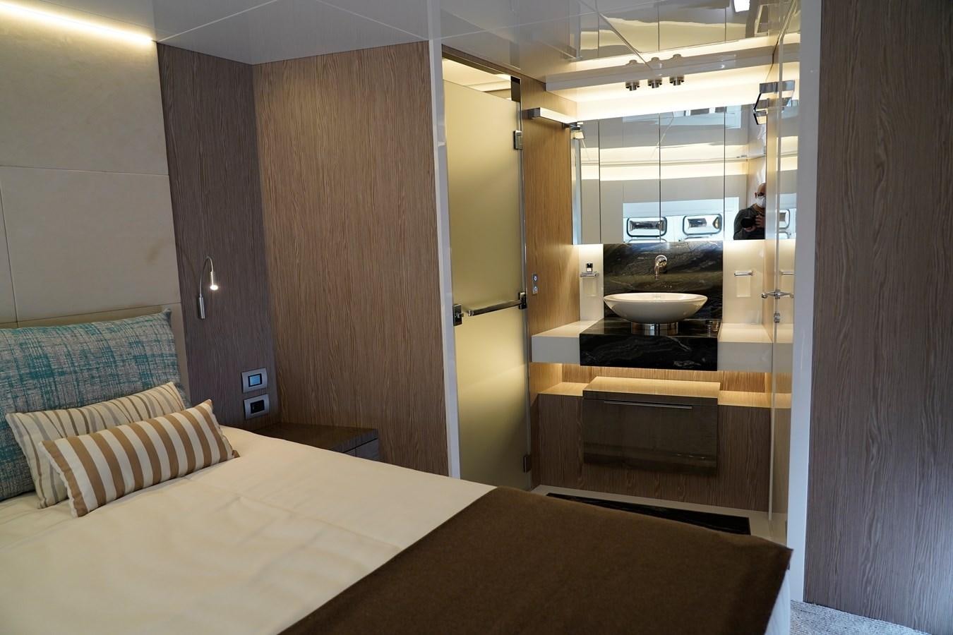 a bed and a sink in a room aboard ARCADIA A85 Yacht for Sale