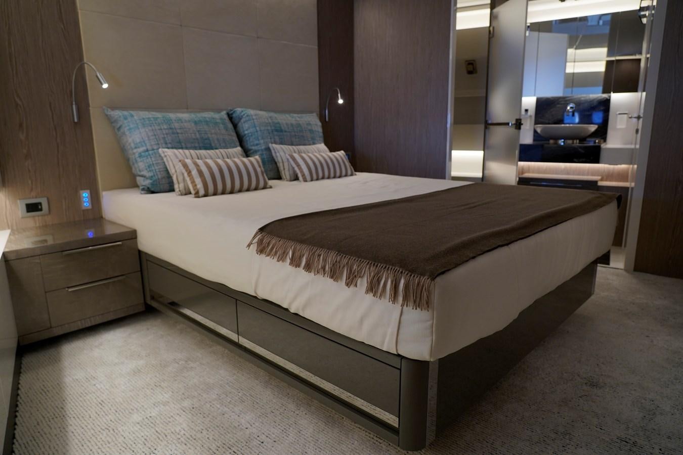 a bed in a room aboard ARCADIA A85 Yacht for Sale