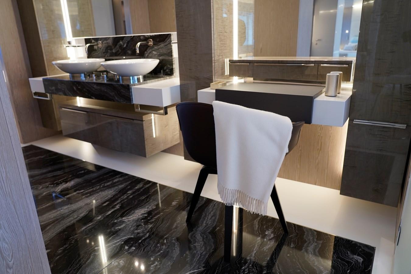 a kitchen with a sink and a chair aboard ARCADIA A85 Yacht for Sale