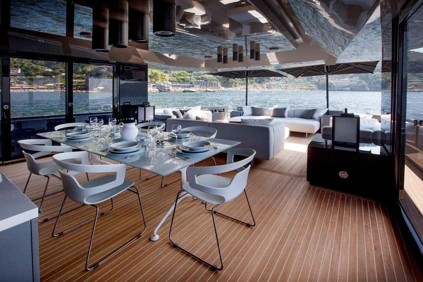 a room with a table and chairs aboard MARCELLO Yacht for Sale