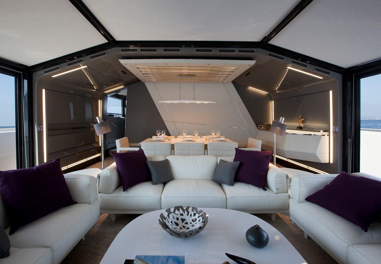a living room with a couch and a table aboard MARCELLO Yacht for Sale