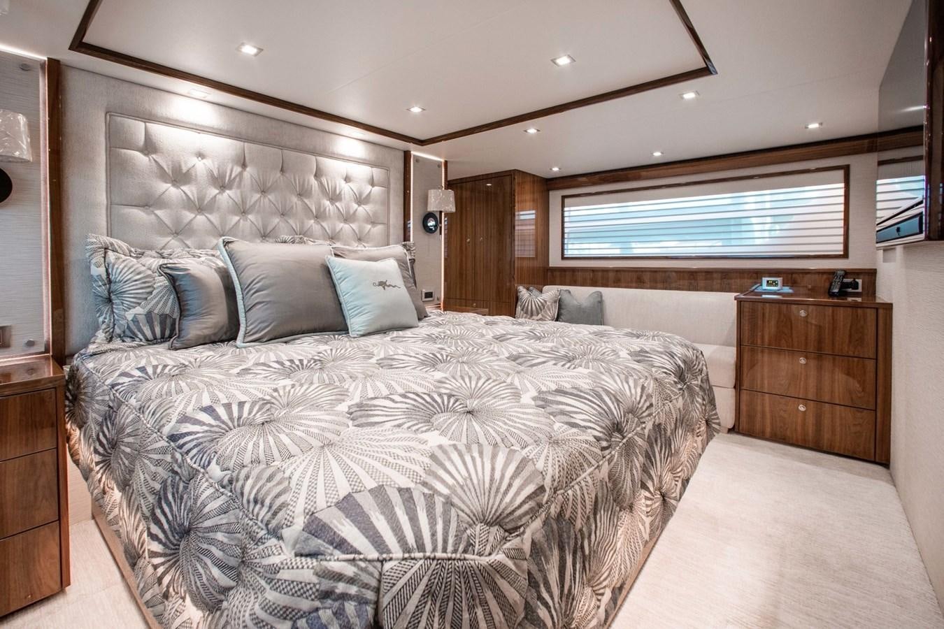 a large bed in a room aboard NEW VIKING 82 COCKPIT MOTOR YACHT Yacht for Sale