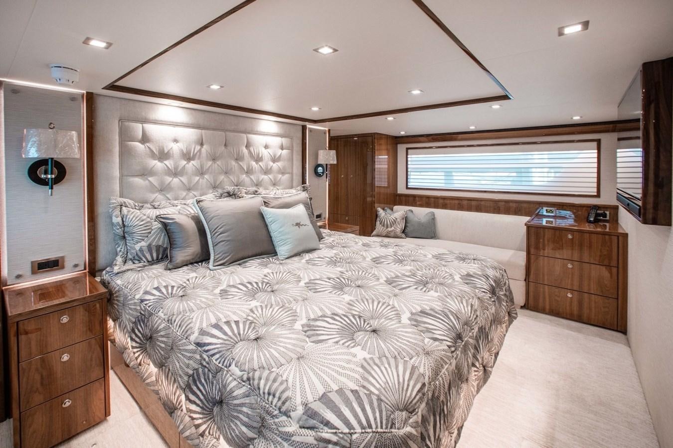 a large bedroom with a large bed aboard NEW VIKING 82 COCKPIT MOTOR YACHT Yacht for Sale