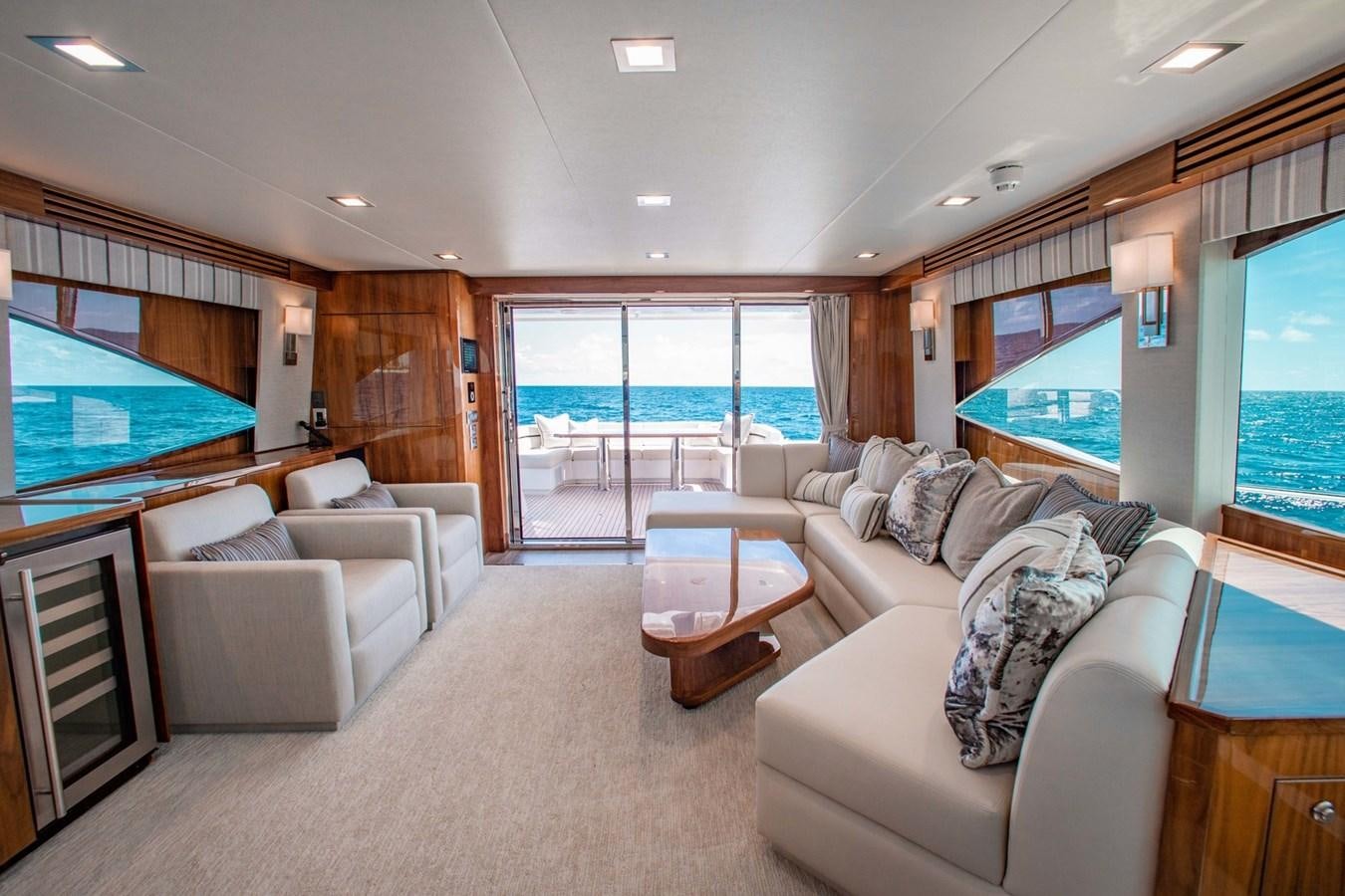 a living room with a large window aboard NEW VIKING 82 COCKPIT MOTOR YACHT Yacht for Sale