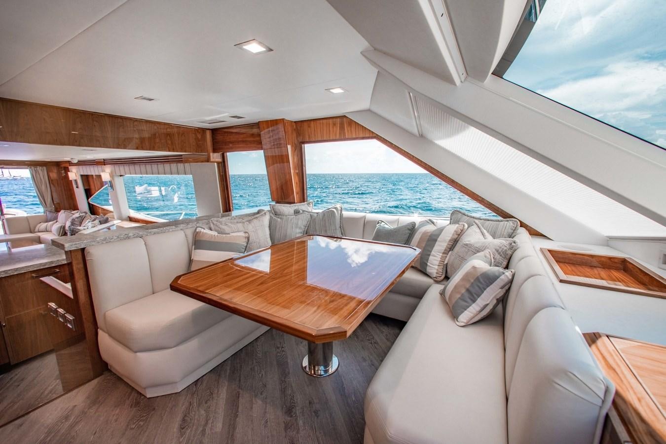 a living room with a large window aboard NEW VIKING 82 COCKPIT MOTOR YACHT Yacht for Sale