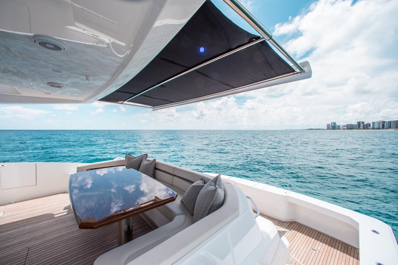 a boat on the water aboard NEW VIKING 82 COCKPIT MOTOR YACHT Yacht for Sale