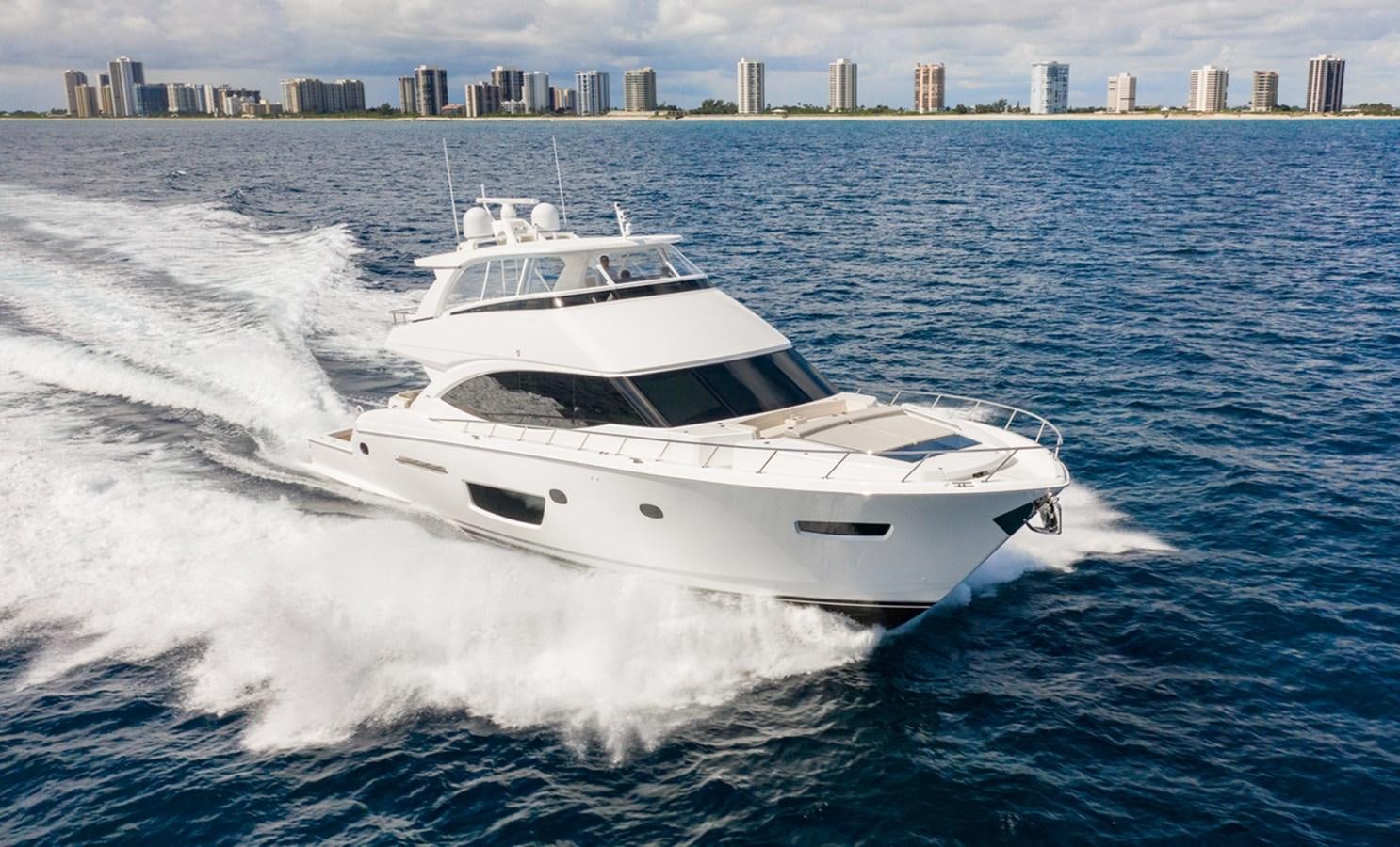 a white yacht on the water aboard NEW VIKING 82 COCKPIT MOTOR YACHT Yacht for Sale