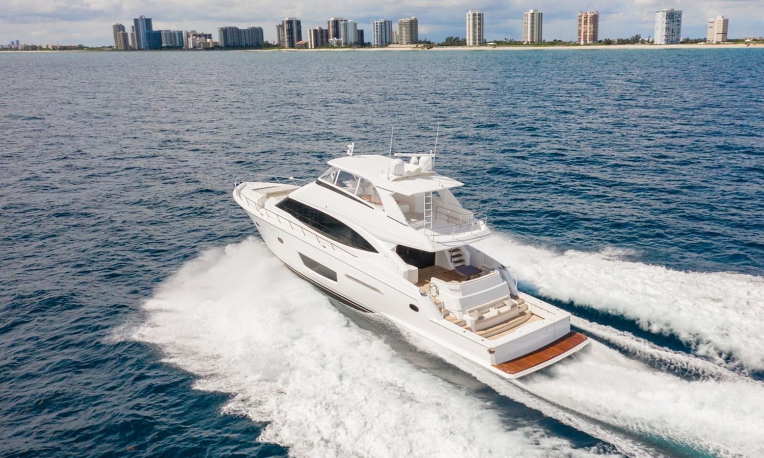 a boat on the water aboard NEW VIKING 82 COCKPIT MOTOR YACHT Yacht for Sale