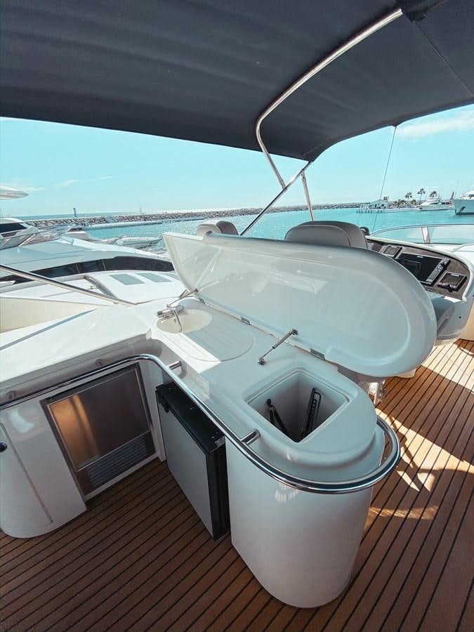 a boat on a deck aboard HELENA Yacht for Sale