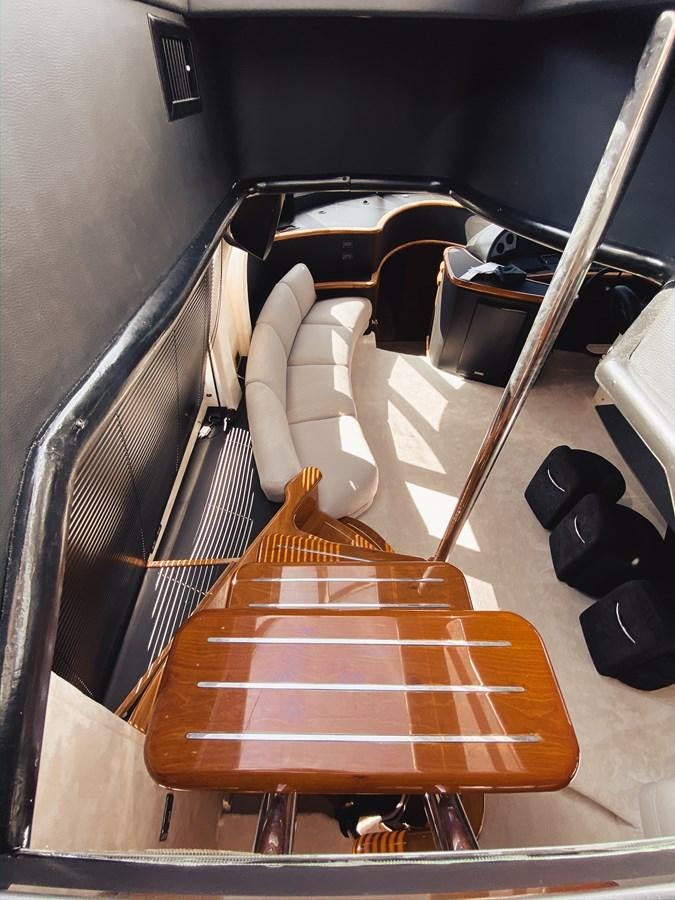 a wooden board on a wooden table aboard HELENA Yacht for Sale