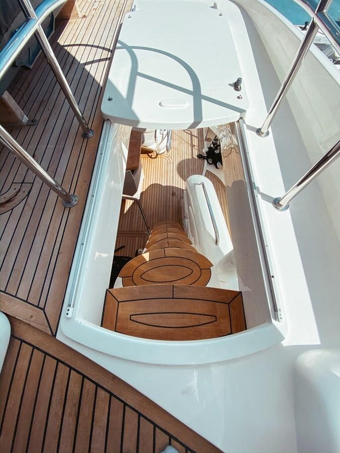 a staircase with a toilet aboard HELENA Yacht for Sale