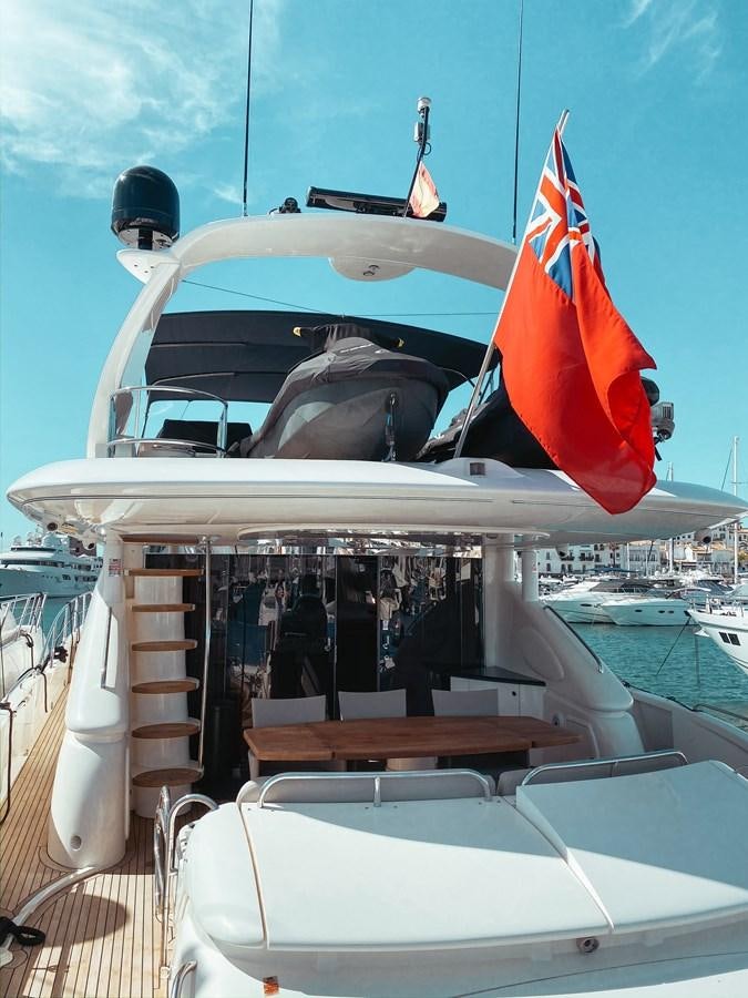 a boat with flags on it aboard HELENA Yacht for Sale