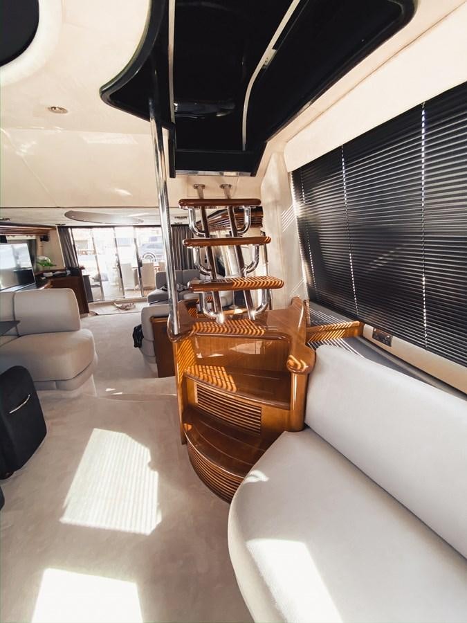 a room with a chair and a piano aboard HELENA Yacht for Sale