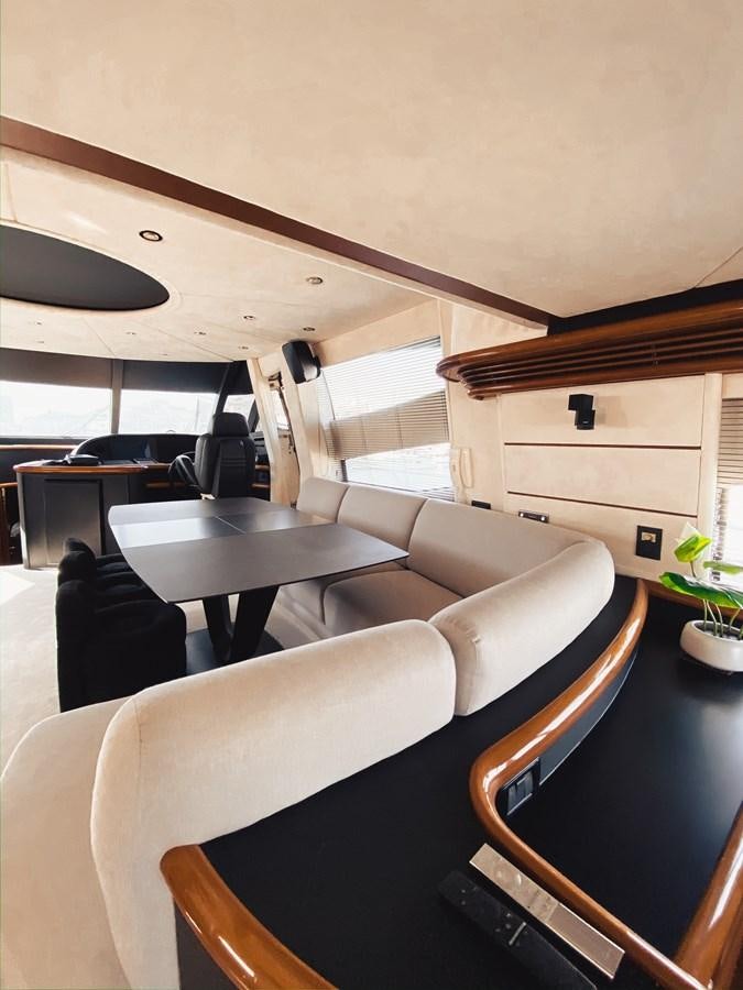 a room with a couch and a table aboard HELENA Yacht for Sale