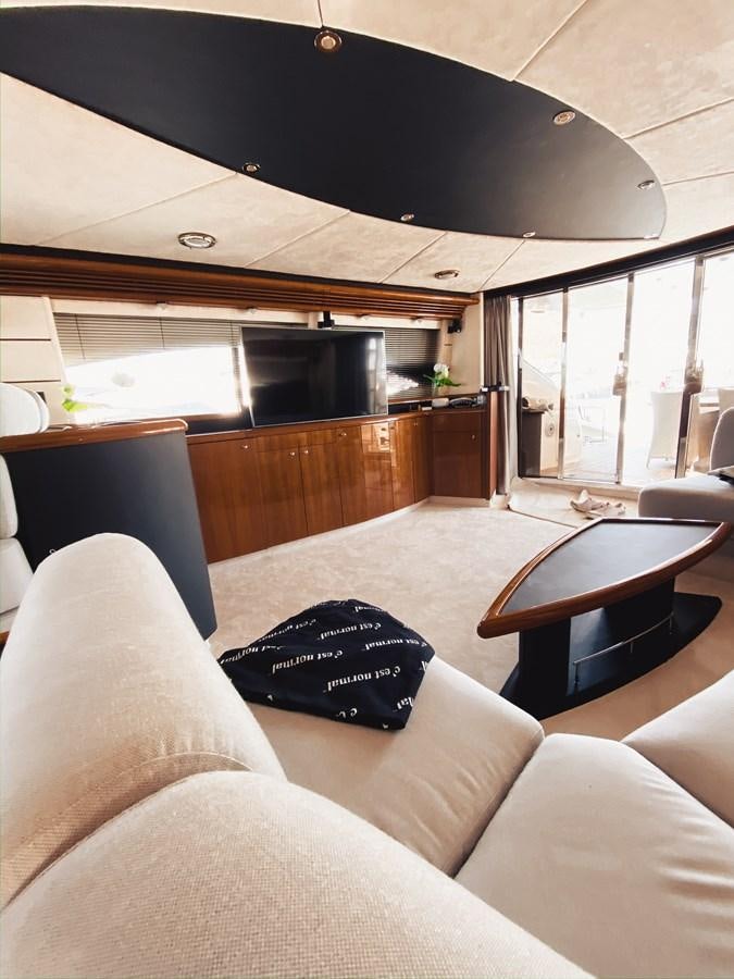 a living room with a large window aboard HELENA Yacht for Sale
