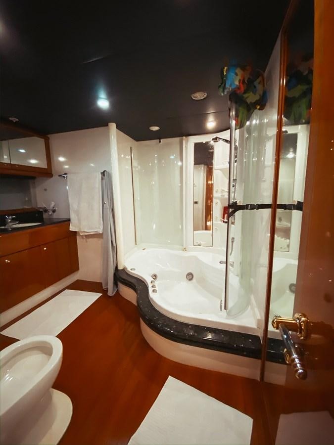 a bathroom with a shower and a sink aboard HELENA Yacht for Sale