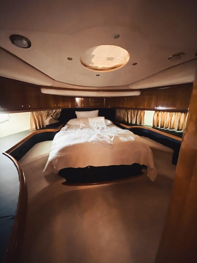 a bed in a room aboard HELENA Yacht for Sale