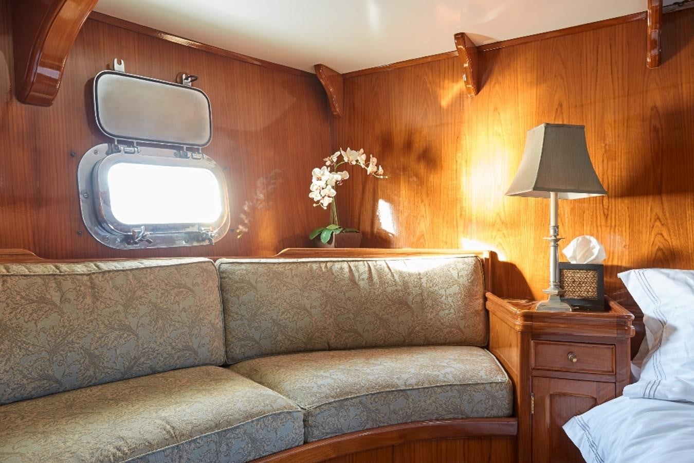 a couch in a room aboard SLOW DANCE Yacht for Sale