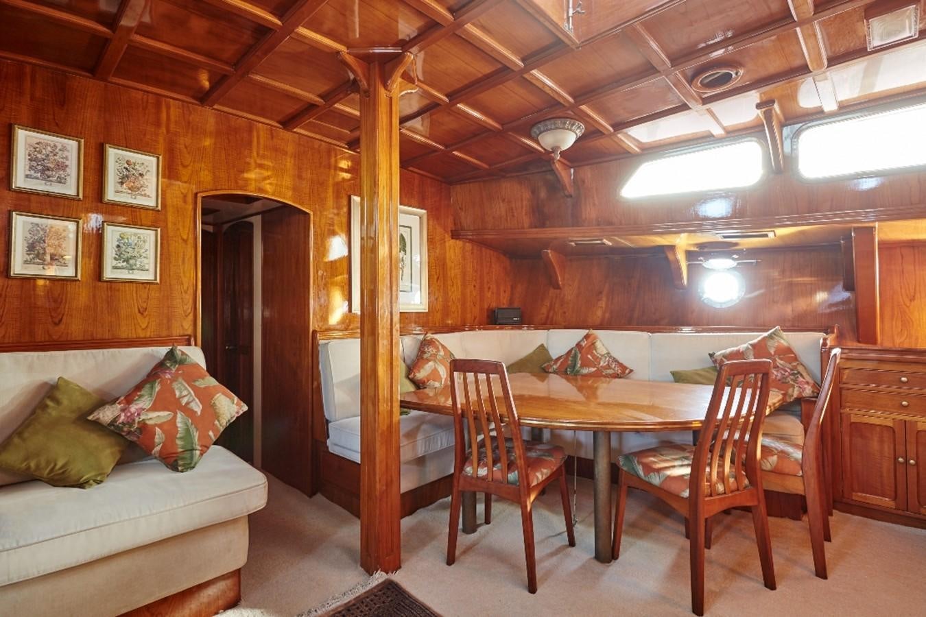 a room with a table and chairs aboard SLOW DANCE Yacht for Sale