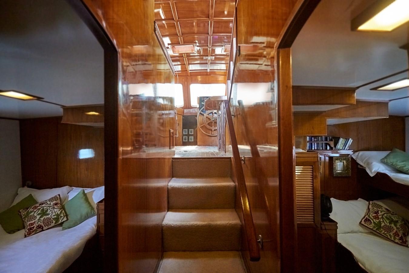 a room with a bed and a wood bunk bed aboard SLOW DANCE Yacht for Sale