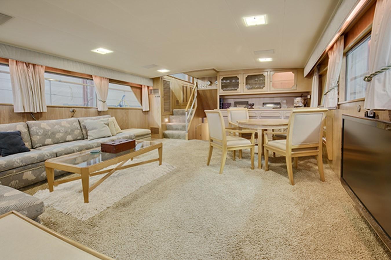 a living room with a couch and a table aboard EXCALIBUR Yacht for Sale