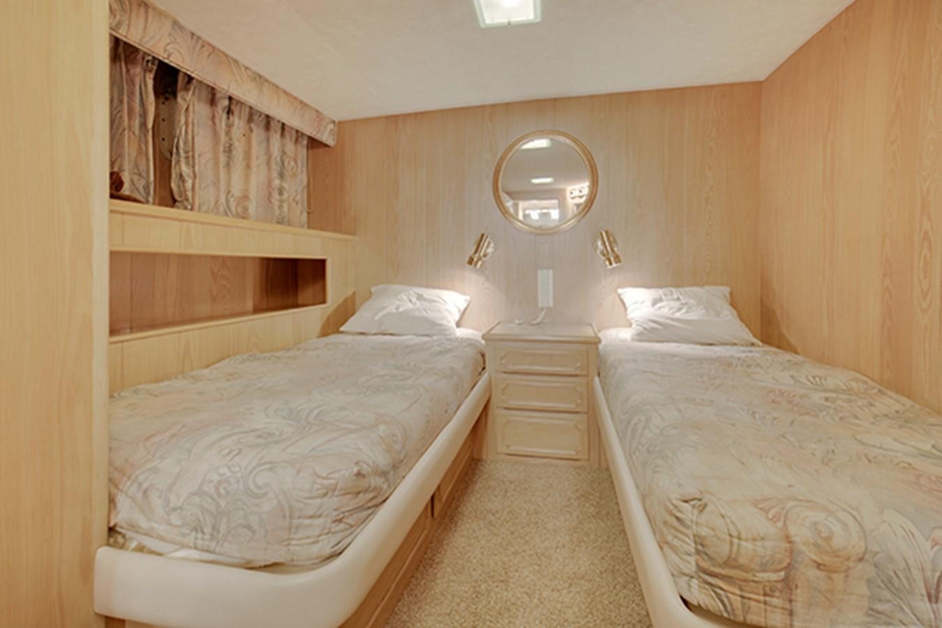 a couple of beds in a hotel room aboard EXCALIBUR Yacht for Sale