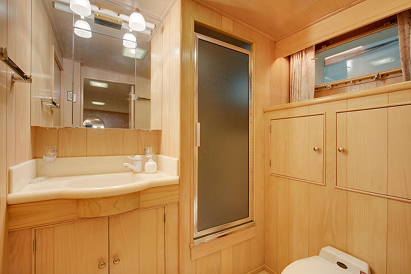 a bathroom with a sink and a mirror aboard EXCALIBUR Yacht for Sale