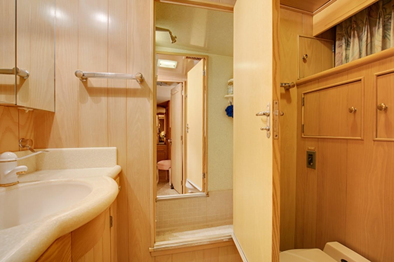 a bathroom with a sink and a toilet aboard EXCALIBUR Yacht for Sale