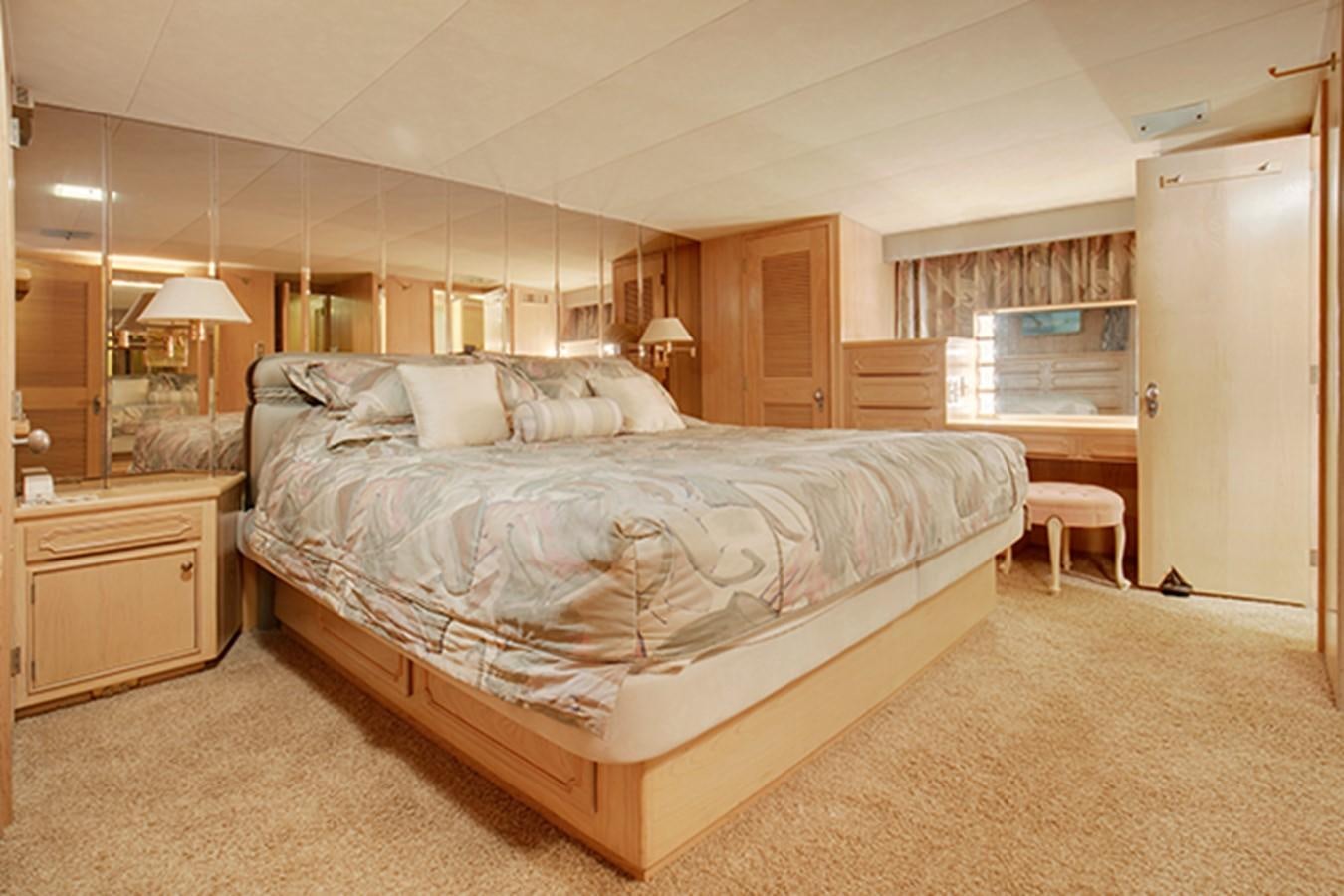 a large bed in a room aboard EXCALIBUR Yacht for Sale
