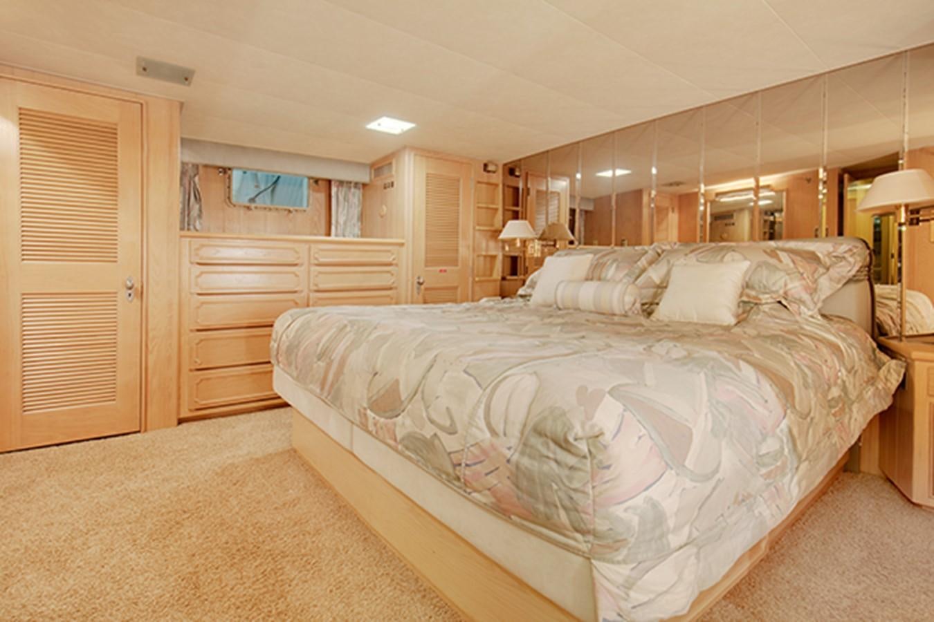 a large bedroom with a large bed aboard EXCALIBUR Yacht for Sale