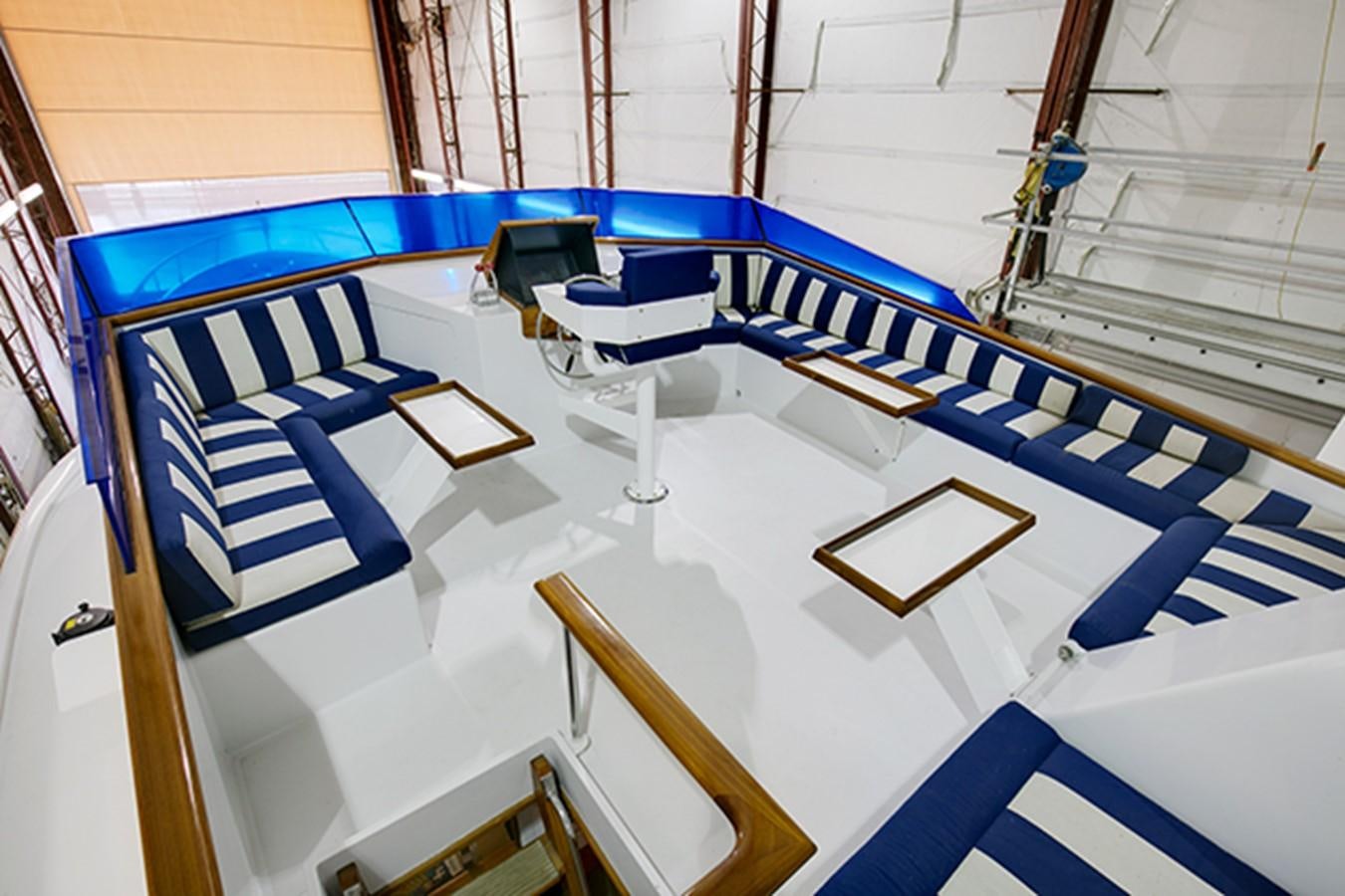a large white and blue model ship aboard EXCALIBUR Yacht for Sale