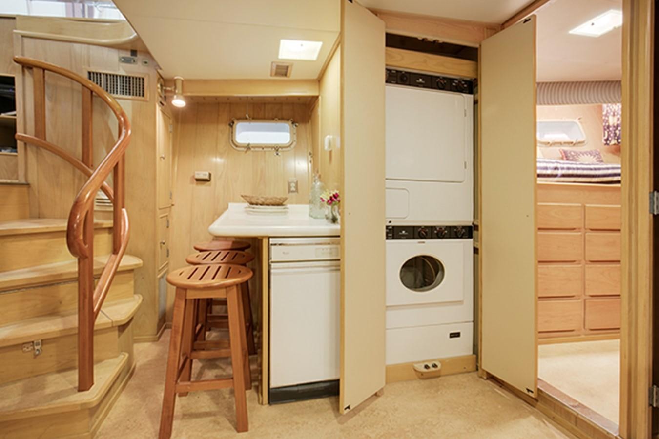 a kitchen with a fridge and a microwave aboard EXCALIBUR Yacht for Sale