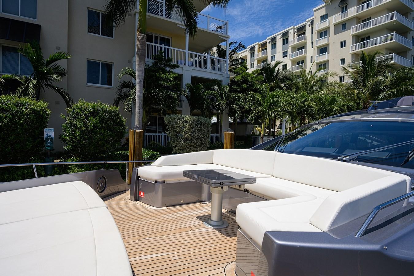 a patio with a table and chairs aboard ON THE MOVE Yacht for Sale