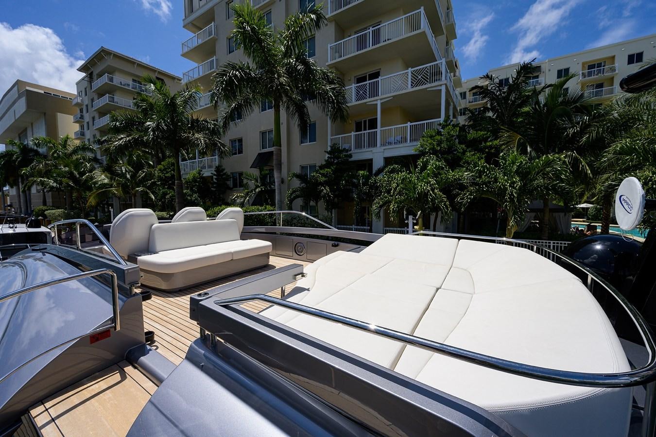 a rooftop with a pool and trees aboard ON THE MOVE Yacht for Sale