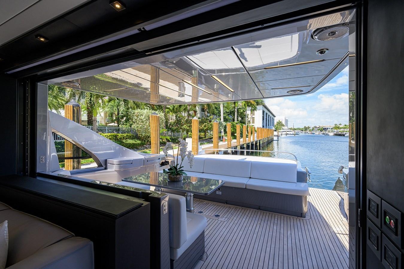 a room with a large window and a view of the water aboard ON THE MOVE Yacht for Sale