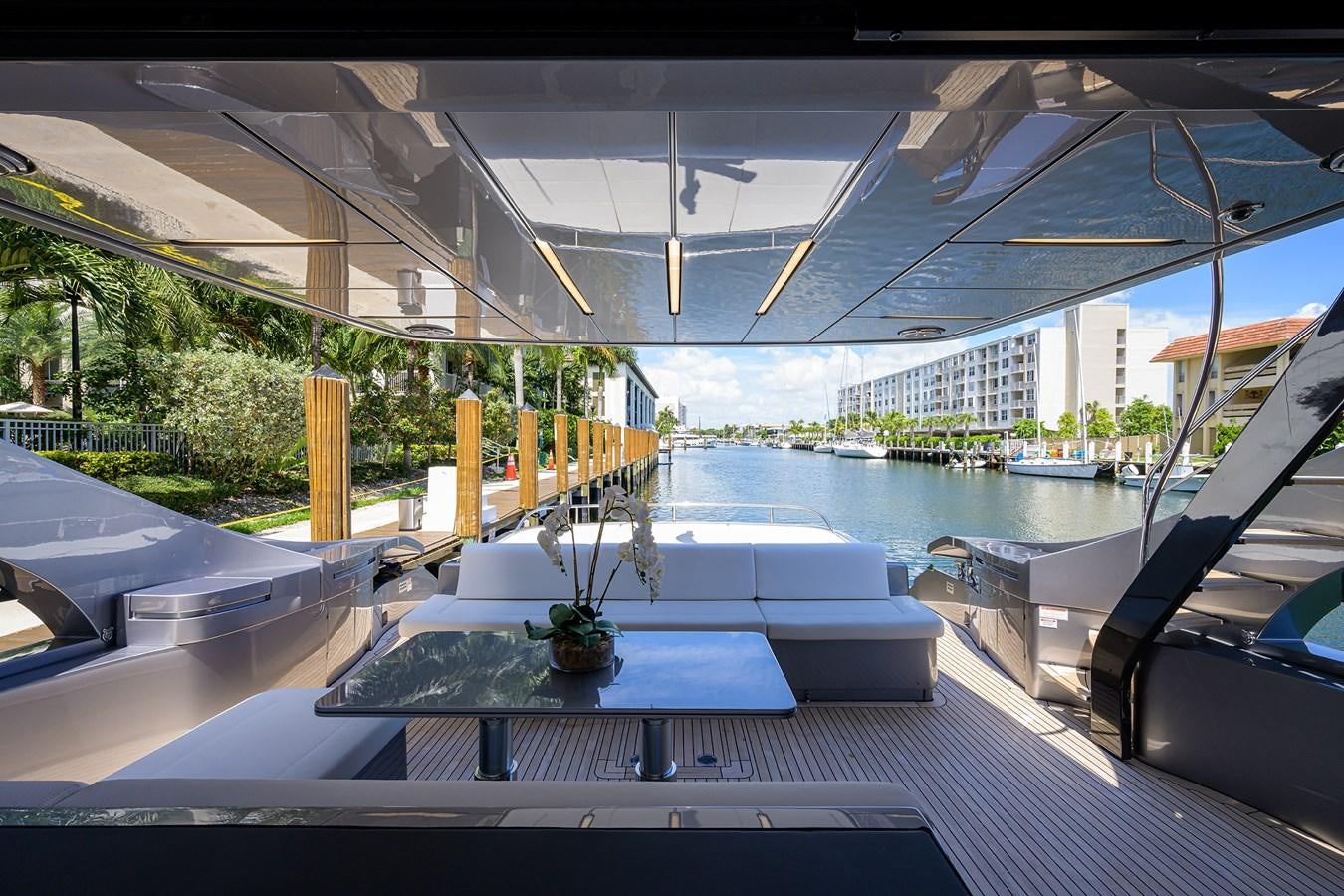 a pool with a table and chairs aboard ON THE MOVE Yacht for Sale