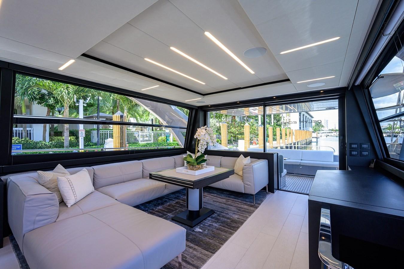 a room with a couch and a table aboard ON THE MOVE Yacht for Sale