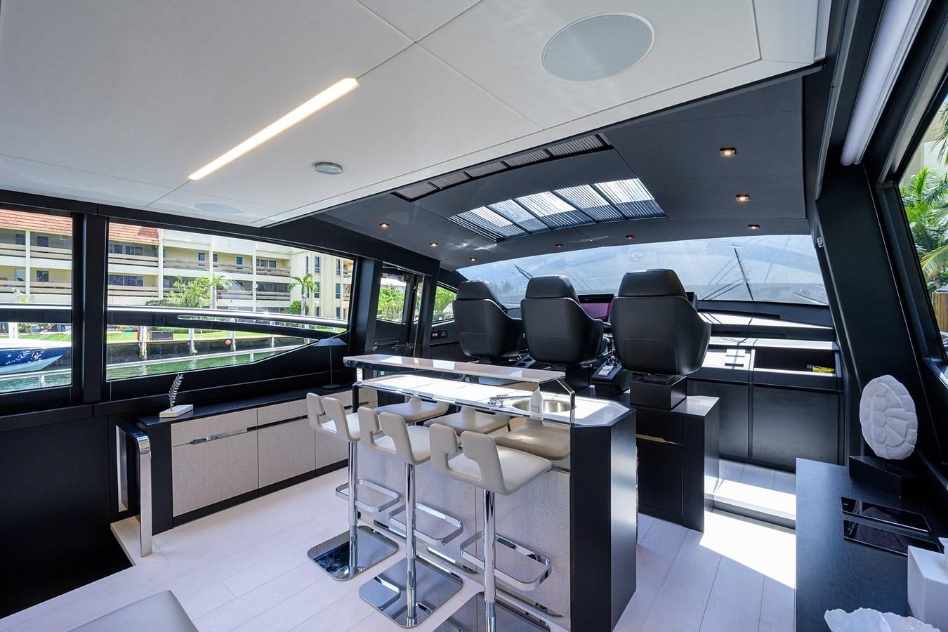 a room with a table and chairs aboard ON THE MOVE Yacht for Sale