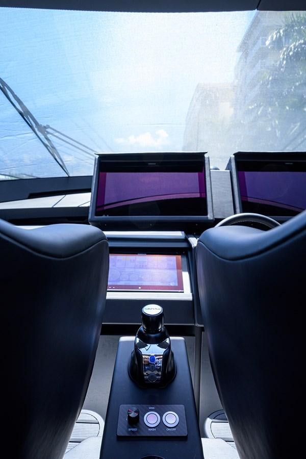 a bottle of water on a desk aboard ON THE MOVE Yacht for Sale