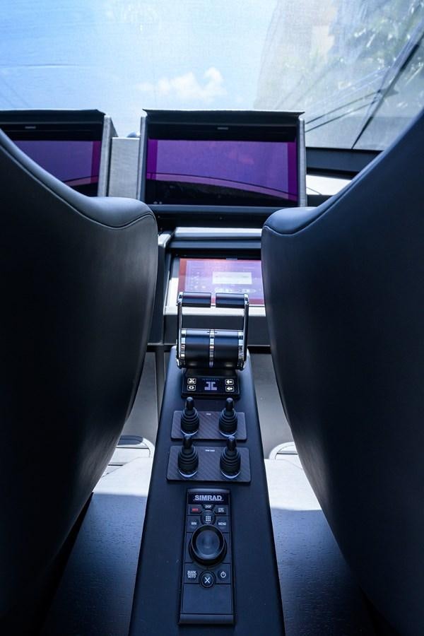 a car with a screen and a monitor in the background aboard ON THE MOVE Yacht for Sale