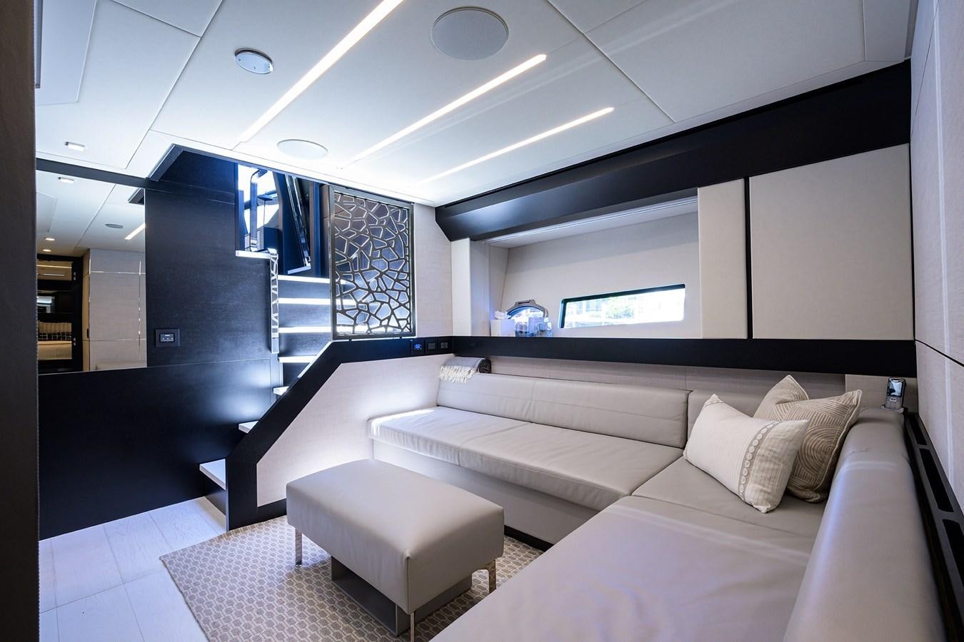 a room with a couch and a window aboard ON THE MOVE Yacht for Sale