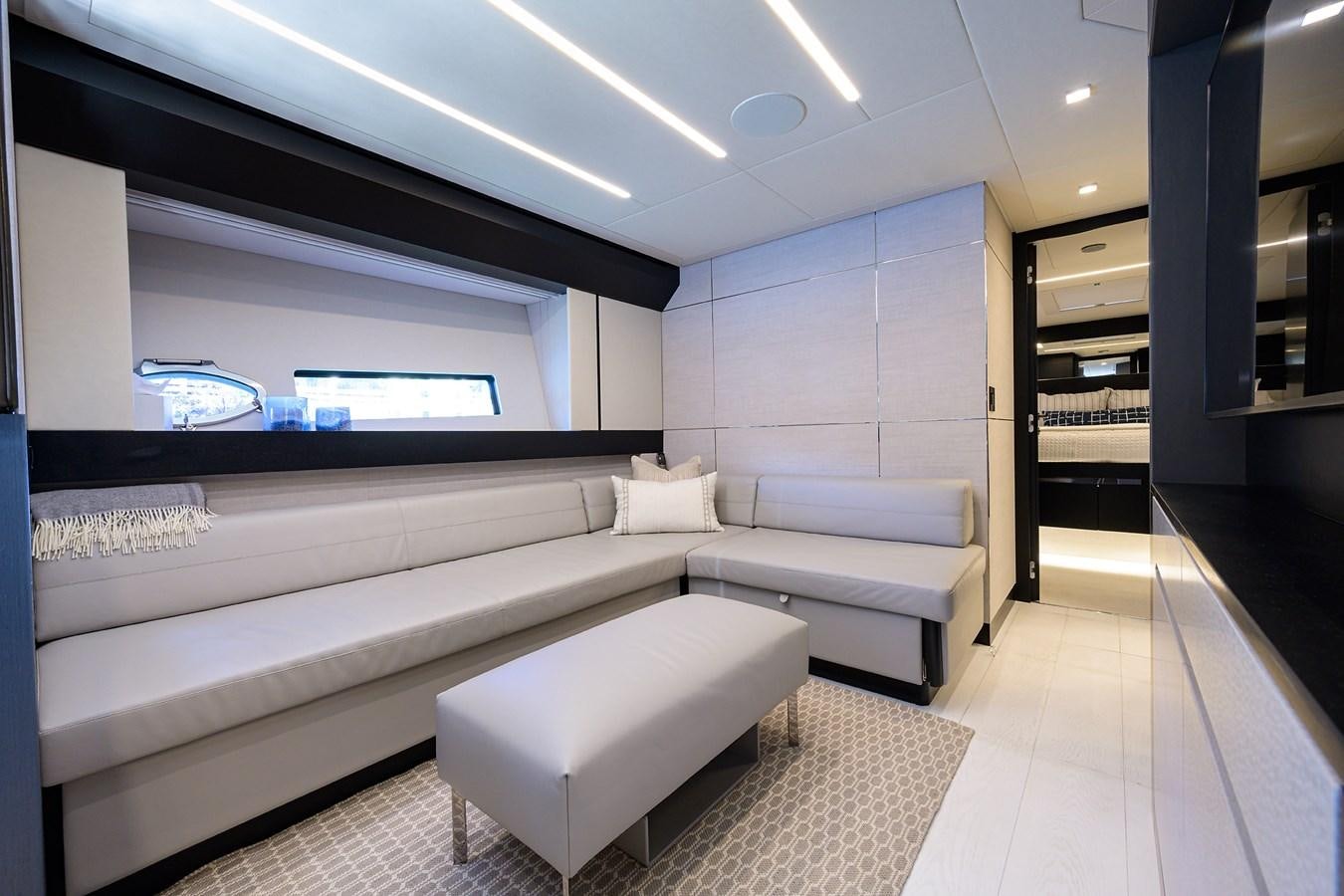 a room with couches and a tv aboard ON THE MOVE Yacht for Sale