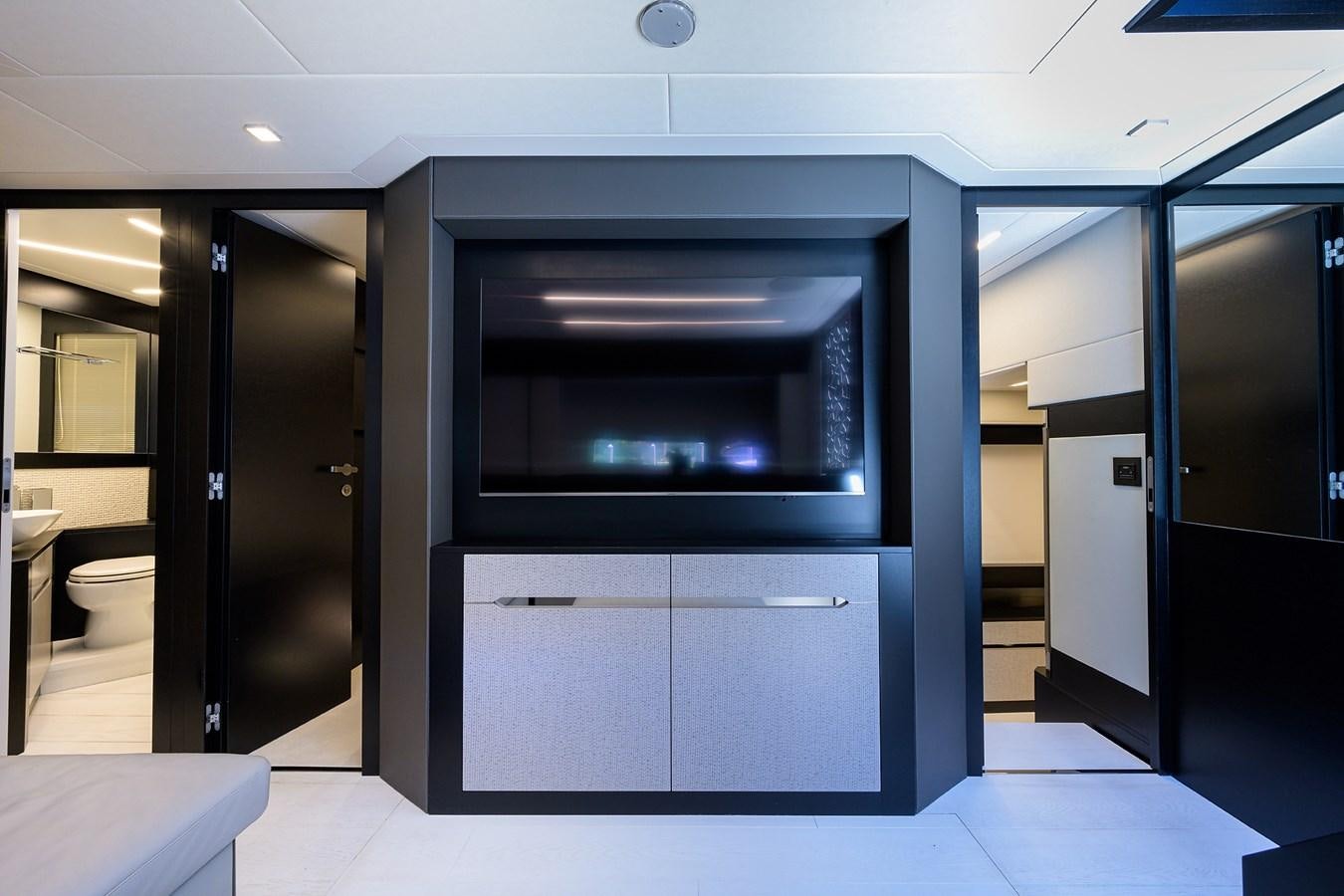 a room with a large black cabinet aboard ON THE MOVE Yacht for Sale