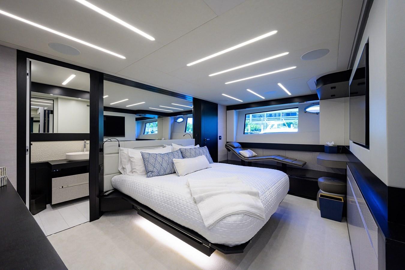 a room with a bed and a desk aboard ON THE MOVE Yacht for Sale