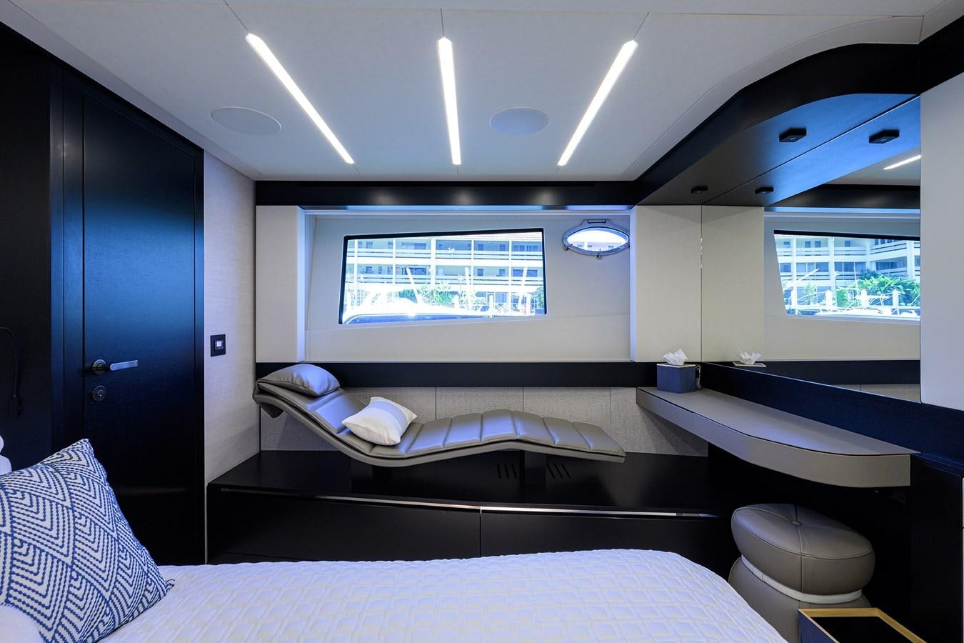 a room with a bed and a window aboard ON THE MOVE Yacht for Sale