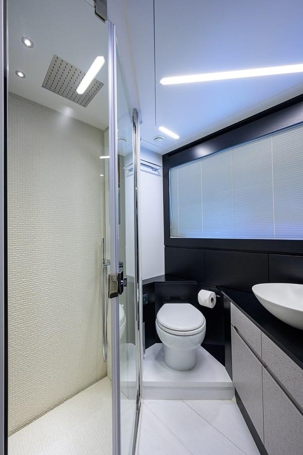 a bathroom with a toilet and a sink aboard ON THE MOVE Yacht for Sale