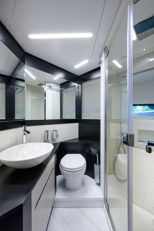 a bathroom with a glass shower aboard ON THE MOVE Yacht for Sale