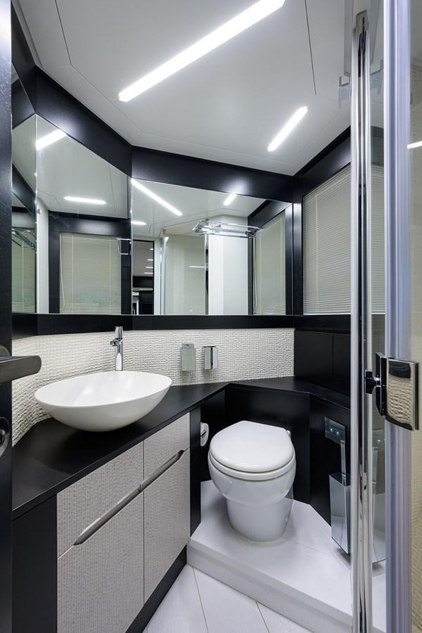 a bathroom with a sink and a toilet aboard ON THE MOVE Yacht for Sale