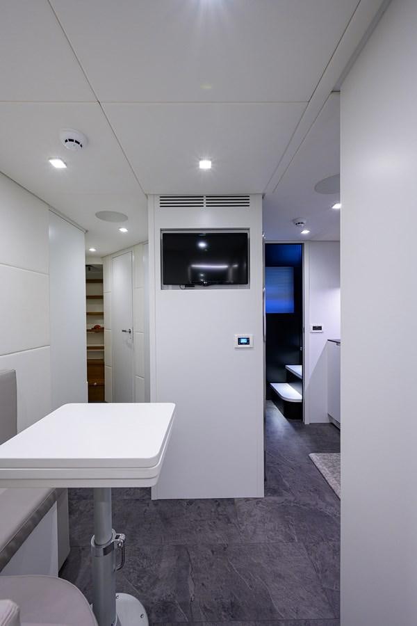 a bathroom with a sink and a tv on the wall aboard ON THE MOVE Yacht for Sale